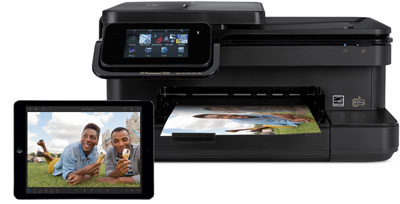  A printer outputting a photo, and in front of it is an iPad Air with its screen showing the printed photo  